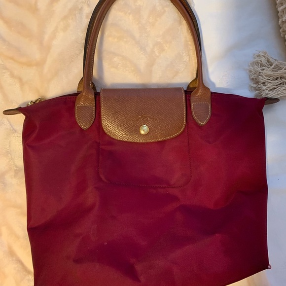Longchamp Handbags - USED MAGENTA LONGCHAMP BAG